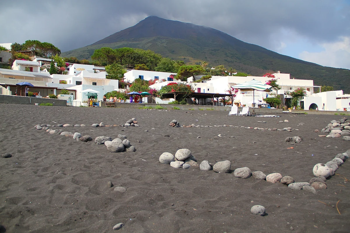 Black volcanic sand beach on Stromboli island below the volcano, Aeolian Islands, Italy