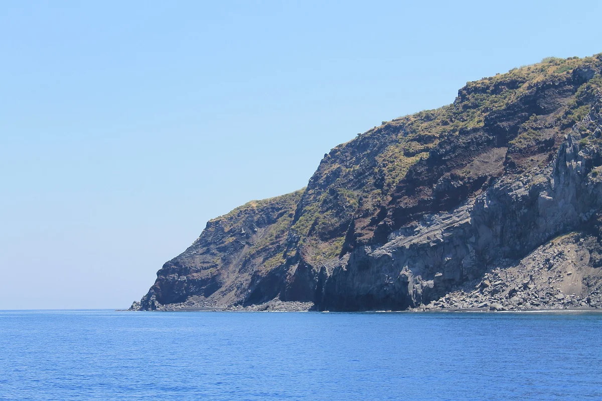 Cliffs of the northern Stromboli coastline meeting the Tyrrhenian Sea, Aeolian Islands, Italy