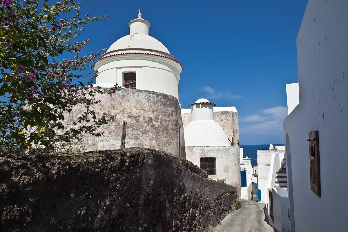 The white houses of Stromboli village below the volcano cone, Aeolian Islands, Italy
